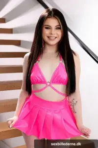 Petite brunette honey Lola Valentine flaunts her round ass and dick anally